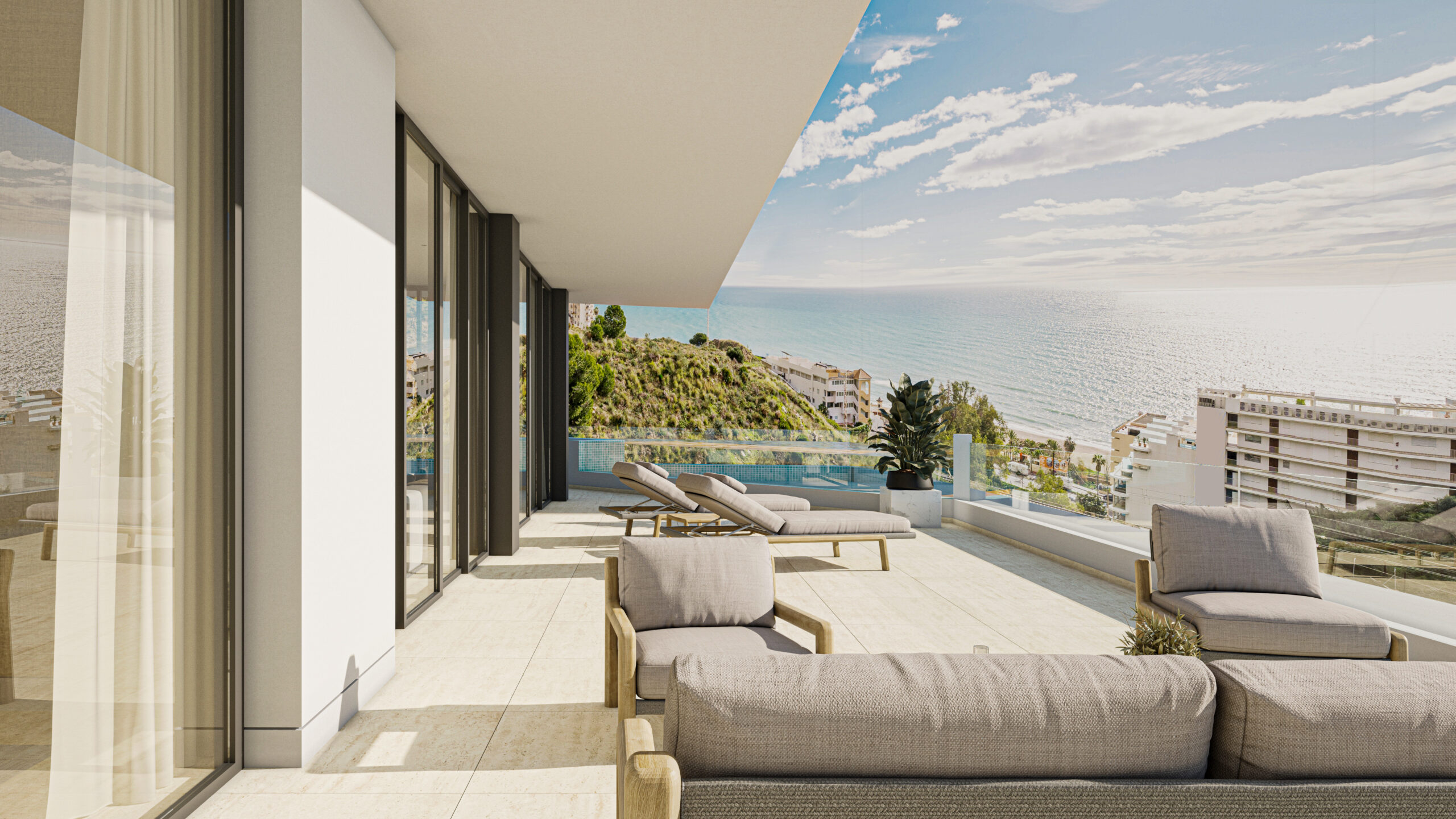 Terraza de ático de lujo con zona louge y vistas panorámicas al mar Mediterráneo